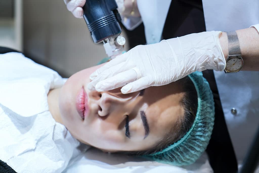 Woman having Morpheus8 radiofrequency microneedling treatment