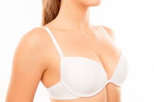 Close up of shapely sexy woman wearing white bra